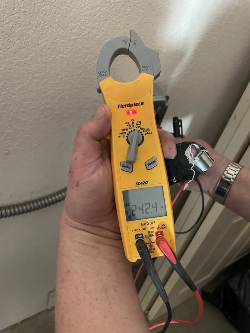 Voltage testing with clamp meter during Outlet Installation in Pasadena